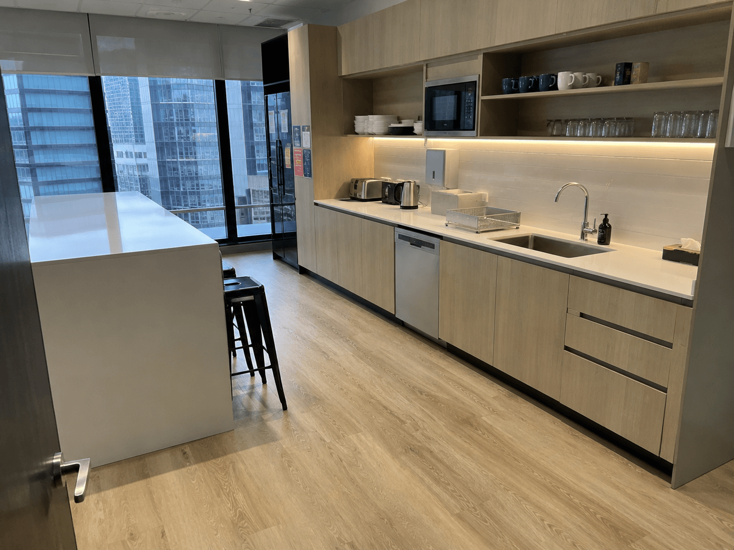 A clean, well-presented office kitchen and breakout area