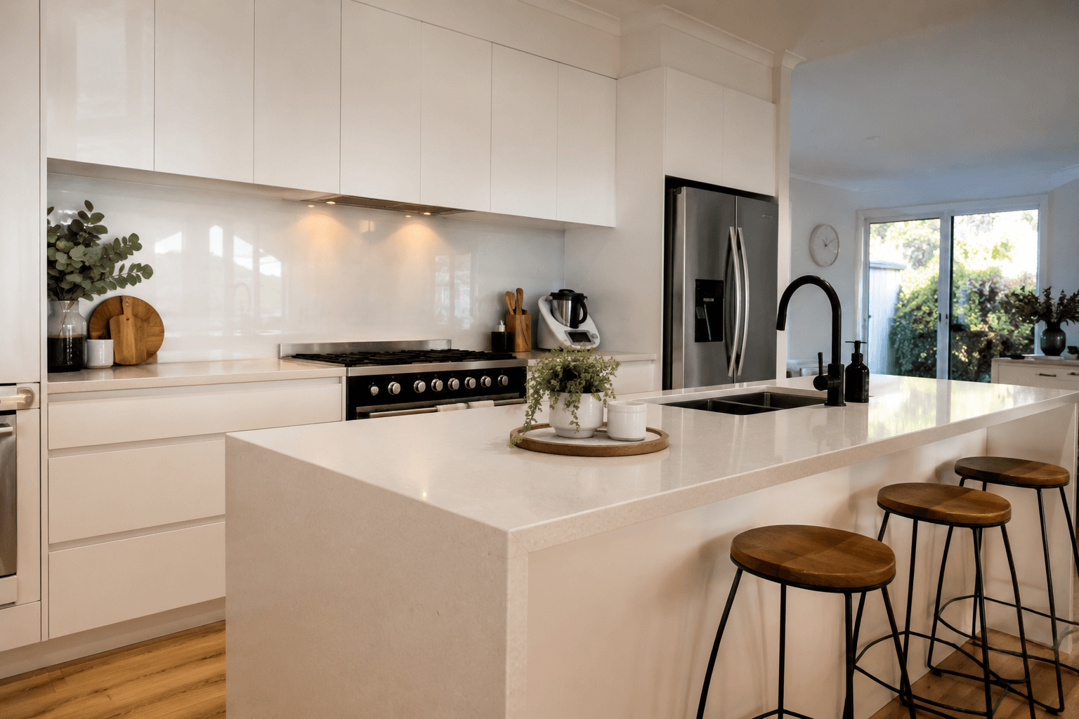 Immaculately cleaned modern kitchen with a large island and warm lighting